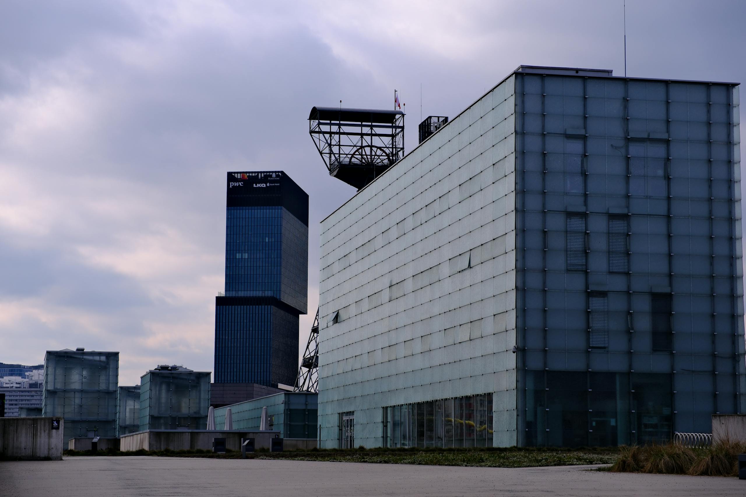 A large building with glass windows and a large building