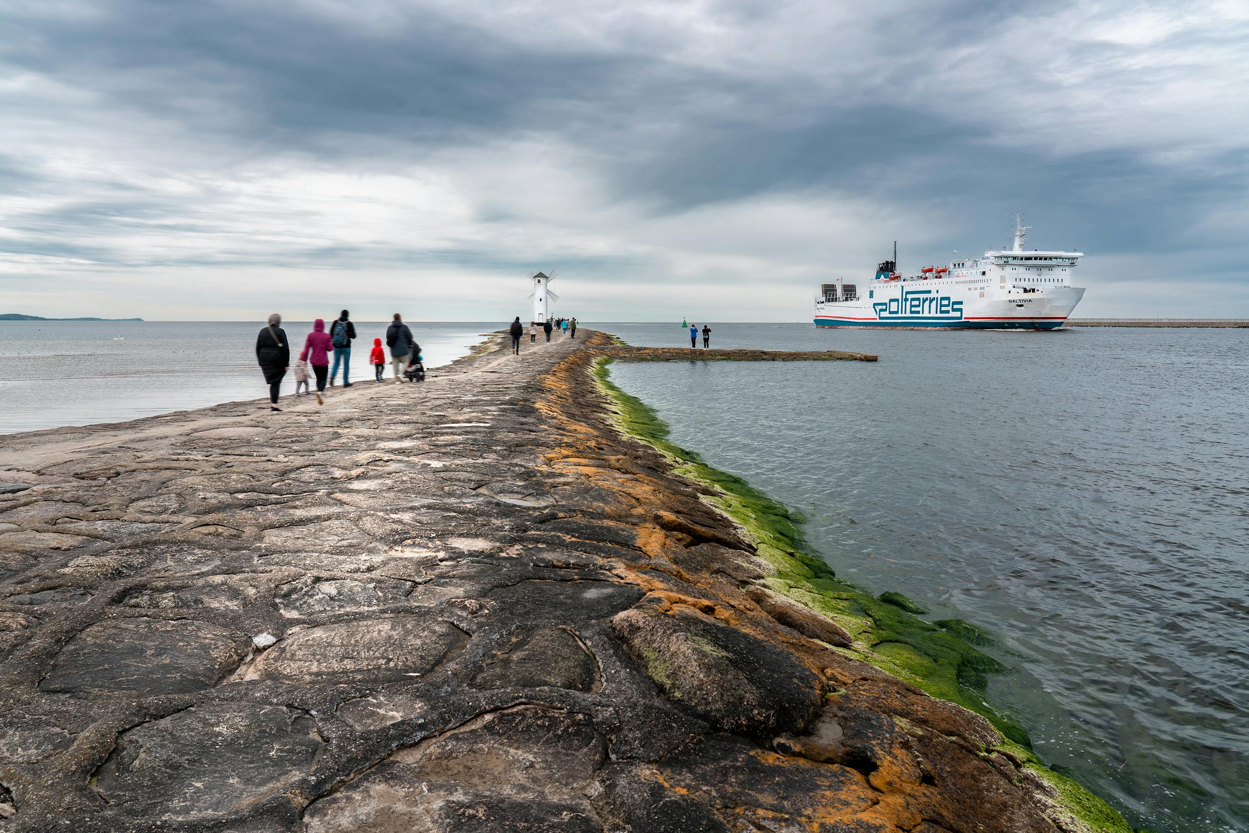 Tourist Walking to Stawa Mlyn in Swinoujscie