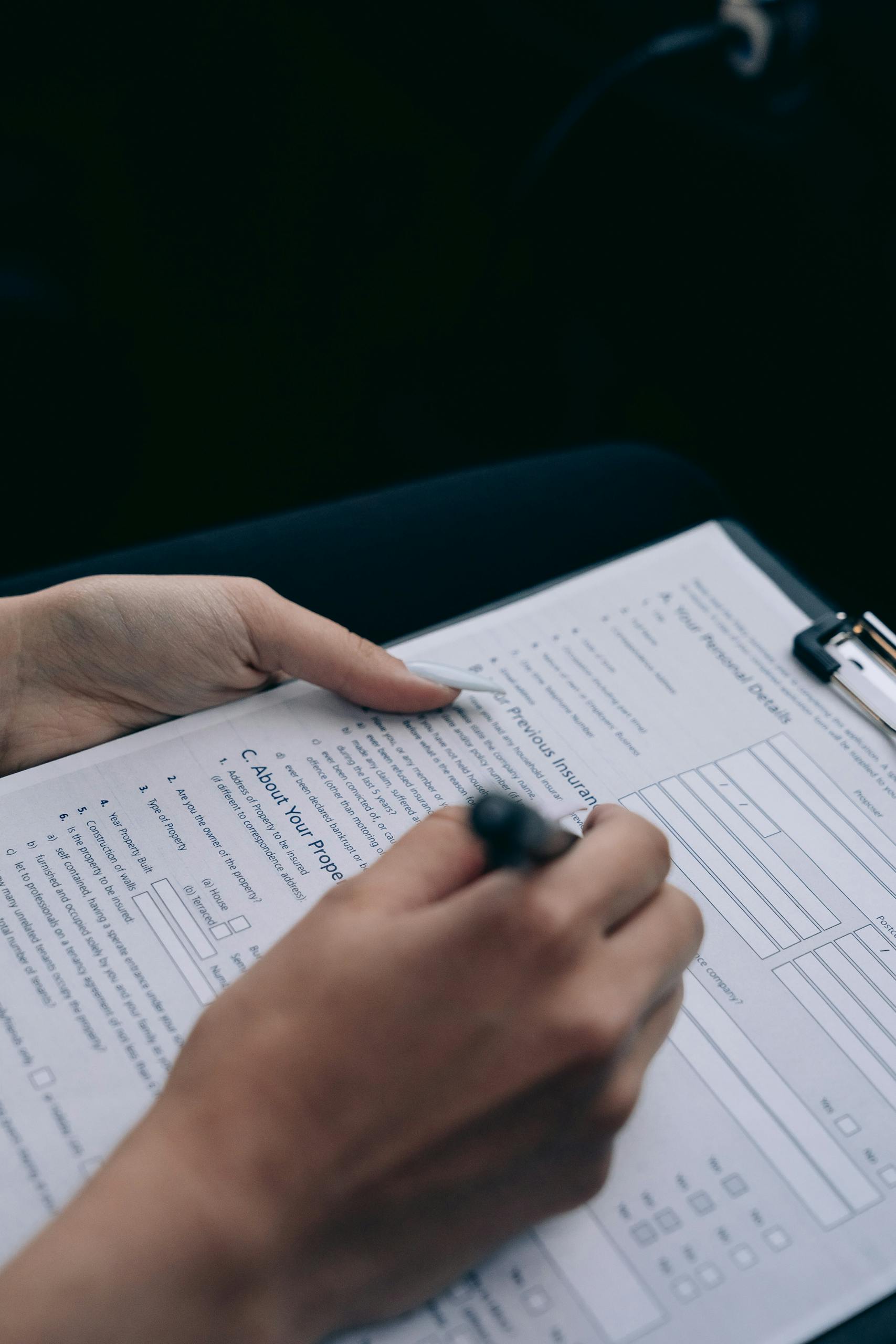 Man Signing Documents